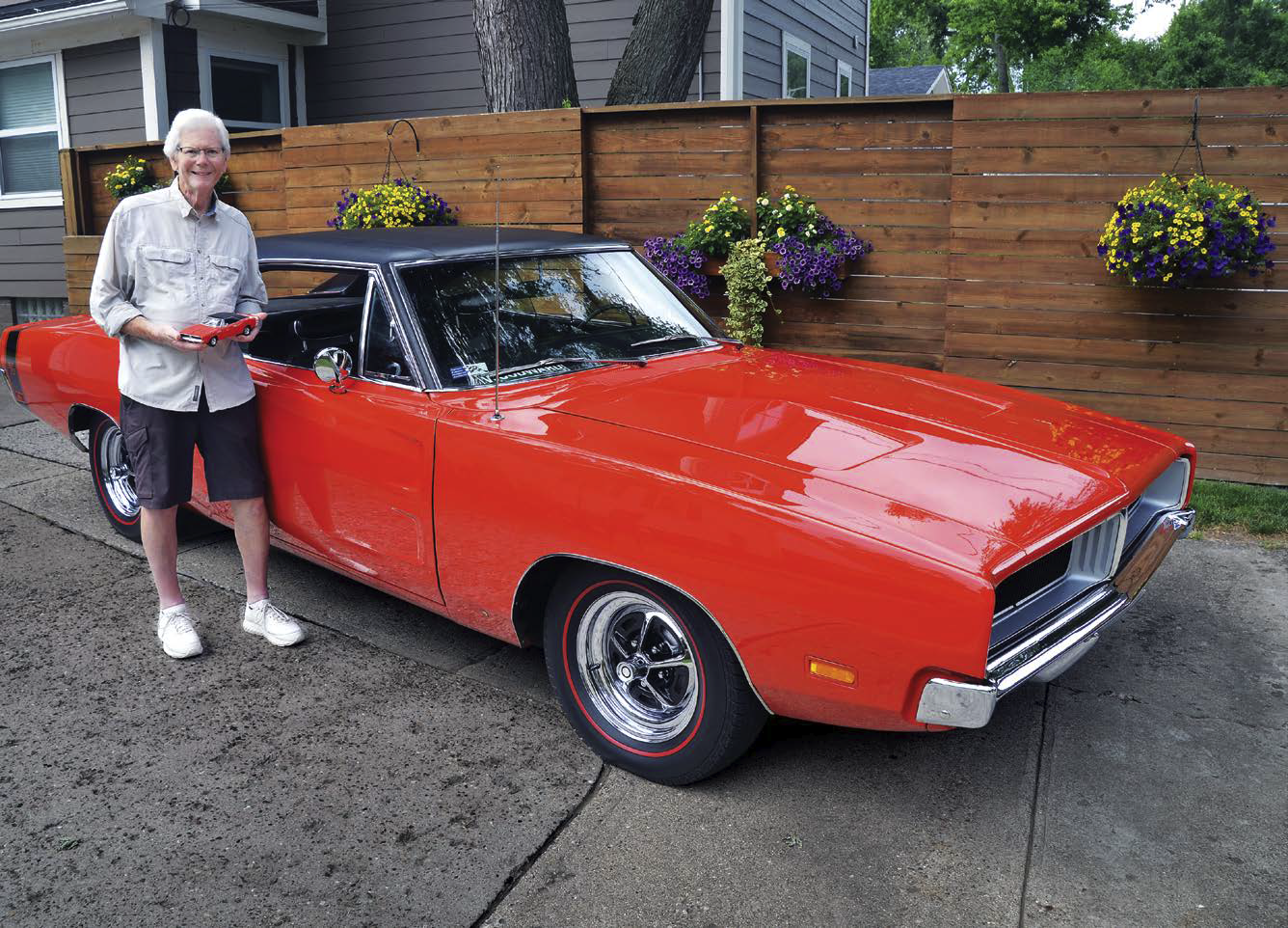 Marc Rozman with his 1969 Dodge Charger and a diecast model of the same